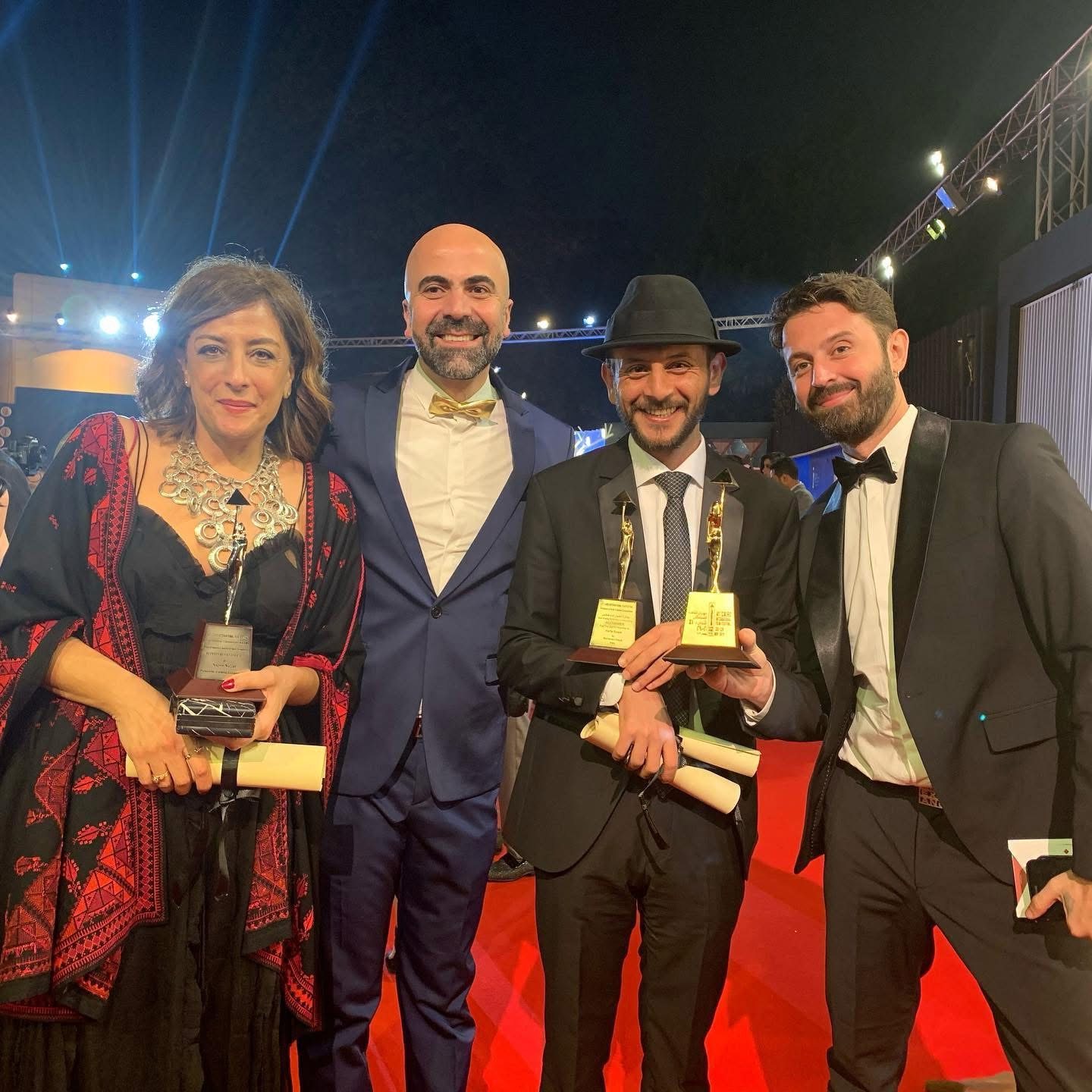 Mohanad Hayal holding the two Cairo International Film Festival awards for Haifa Street, with Alaa Karkouti and Maher Diab of MAD Solutions and Palestinian director Najwa Najjar, 2019